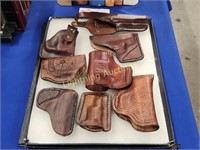 EIGHT LEATHER FIREARM HOLSTERS