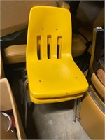 Two vintage yellow plastic seat chairs