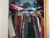 Closet of ladies coats, shirts & sweaters