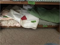 Shelf lot of table cloths