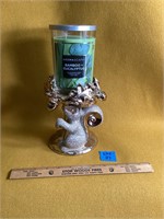 Squirrel candle holder with candle