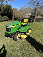 John Deere X320 riding lawn mower