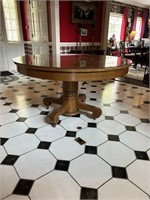 Round oak dining table with glass top