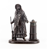 Cast Metal Lady Sweeping Matchstick Holder