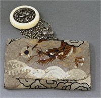 Embroidered tobacco pouch and netsuke.