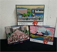 New, two 750 piece and one 500 piece puzzles