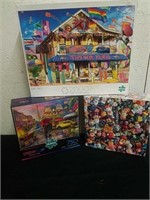 2 750 piece puzzles and one 2,000 piece puzzle