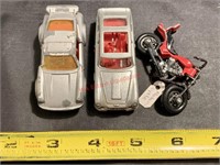 Matchbox Porsche Turbo, Corgi Aston Martin, and