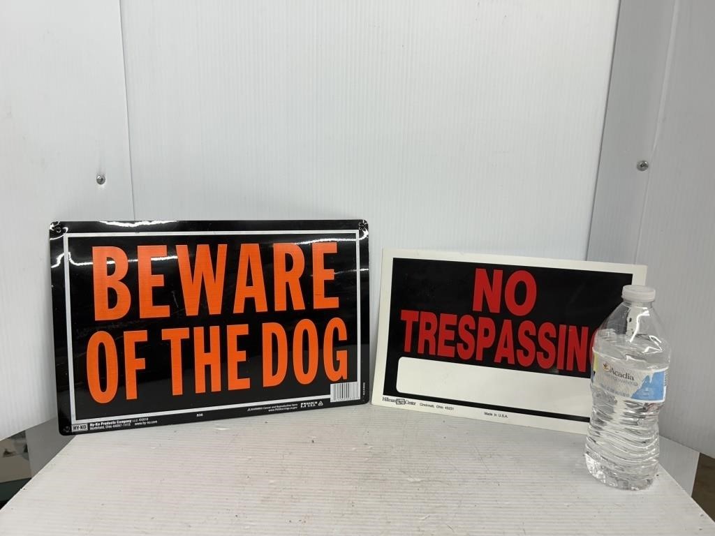 Lot of two signs includes no trespassing and