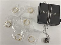 1 necklace and 6 adjustable wage rings