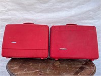 2 red vintage plastic suit cases