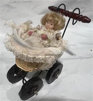 Mini Porcelain Doll in Wood Buggy