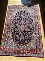Area rug -believe to be Persian