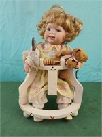 Baby doll in wooden walker