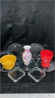 Various glass plant saucers and vases