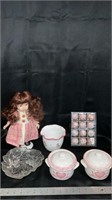 Porcelain doll, kitchen canisters,floral pot,