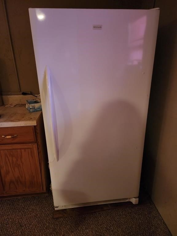 Frigidaire upright freezer (contents not
