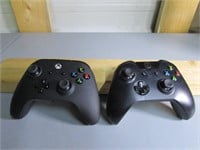 Two Black XBox One Controllors