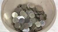 Tub of token coins
