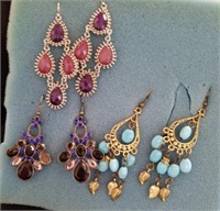 Three pairs of earrings dangle