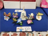 SEVEN CERAMIC BUTTERFLY AND FLOWER FIGURINES