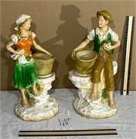 man and woman matching statue