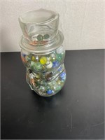 Vintage marbles in snowman jar