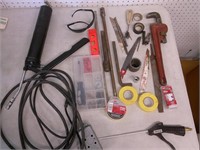 grease gun, pipe wrench, cords, tape