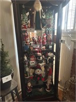 Contents in Curio Cabinet - mostly Santas