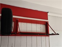 Wall mount tire racks.  Look at the photos for