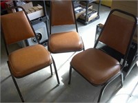 three stackable chairs
