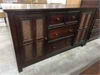 Dark wood dresser with 4 drawers and 2 doors