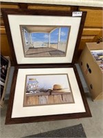 2 brown framed pictures