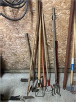 large lot of garden tools, rakes, pick axe and mo