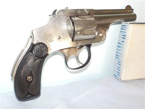 Smith & Wesson 32 cal. flip top revolver.