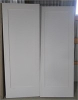 (2) Single panel wood interior door slabs. Both