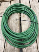 Roll of green garden hose