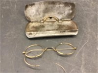 Antique glasses in steel case