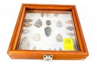 Display Case of Various Arrowheads and Game Stone