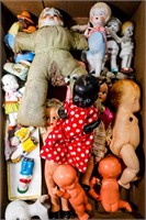 Flat of Bisque, Plastic and Porcelain Dolls