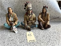 3 seated Indian Figures
