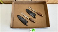 Set of double bevel hunting knives with sheaths