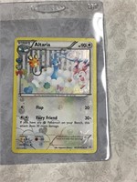 Pokémon holo card in case