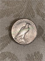 1928 Silver peace dollar.