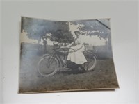 antique photograph woman on motorcycle