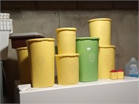 group of Tupperware canisters
