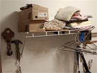 pet crate,basket & towels on wirey shelf