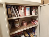 various canned foods in metal cabinet