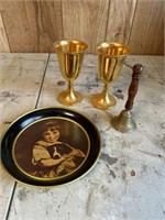 Gold colored goblets, tray and brass bell