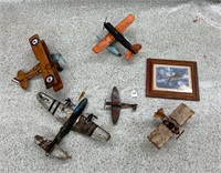 5 Hanging toy planes and framed mosquito picture